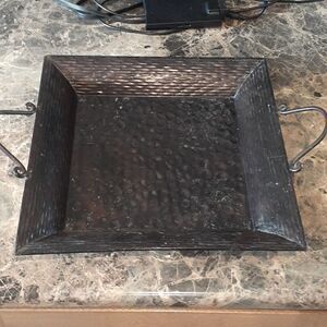 Beautiful pounded metal tray with handles.